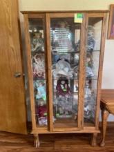 Vintage curio cabinet with glass shelves, and key to lock. Contents in cabinet are not included.