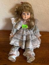 Porcelain doll and gray with pink trim