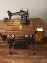 Antique singer sewing machine converted into electric foot petal and light. 36.5x18x30 inches. Bring