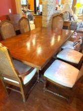 Dining room table with nine chairs, felt protector included, two leaves, 70 x 40 x any items on the