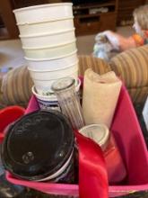 Plastic cups, candles, glass vase