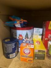 Pantry goods, popcorn in tin can, jolly rancher suckers, peanuts, baking soda, popcorn, vinegar,