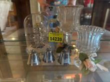 Candle holders, bells, and Christmas tree in dome