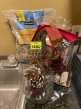 Glass vase, bag of fragranced potpourri, and bag of bird feed