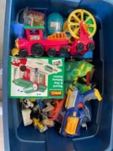 Tote full of toys, mostly train toys