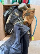 Army clothes, backpack, and jug water