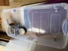 Storage tote with wheels, some cds and computer games, not all cases have cds inside