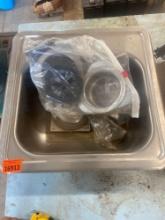 Small sink with plumbing items