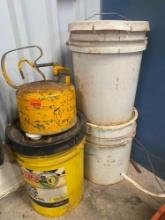 Gas can labeled Kerosene, 5 gallon bucket labeled hydraulic fluid, 2 unlabeled Contents unknown