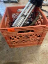 Milk crate with tripod, halogen light, cord, gun books