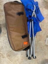 Folding chair and a brown bag