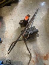 Vintage bottle jack, metal poles, and misc steel item
