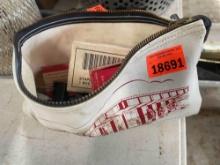 Money bag with staples and paper clips
