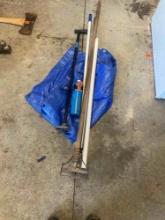 Tarp, cane, mop handle, Turner propane bottle, broom handles