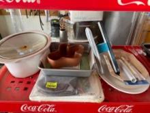 Crock pot dish, cake pan, cactus dish, oven mitts, cutting boards, squigee spray bottle, platter and