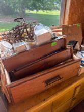 cheese, grater, wooden decor, measuring cups, and wooden drawers