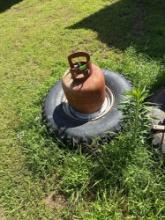 gas can tires hose rope and wood