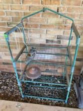 Outdoor metal shelf and some decor