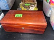 Cedar box with various items inside