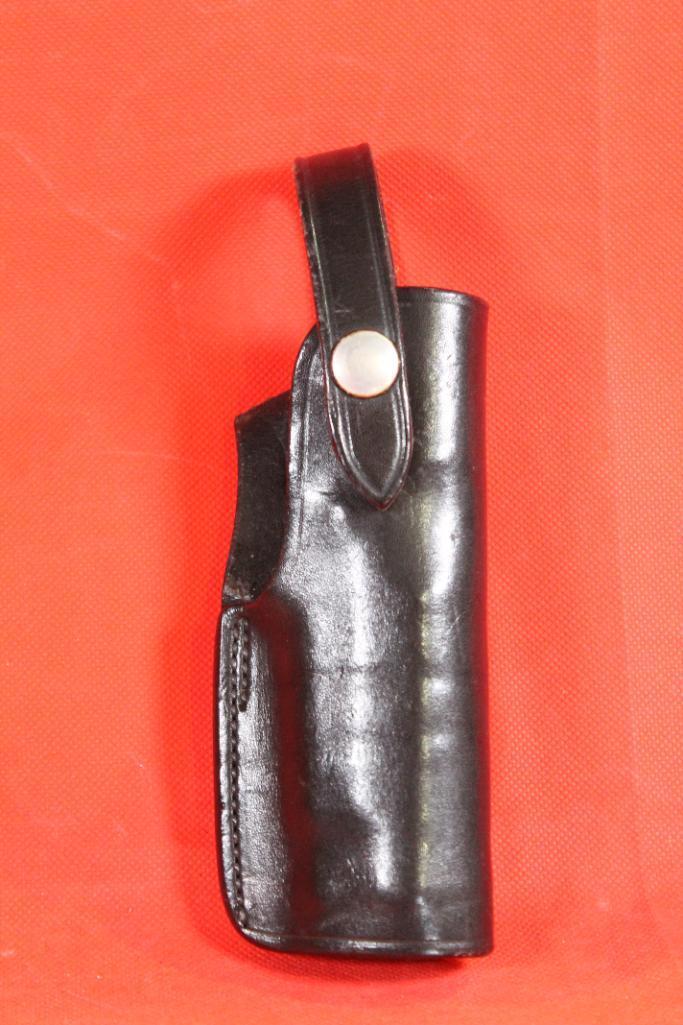 Bianchi black leather right handed snap holster for S&W 9mm.
