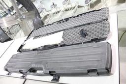 Two 48 inch plastic, foam lined single rifle cases. Used