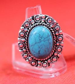 Three German silver rings. One size 6 Blue Topaz stone, one size 7 green emerald stone and one size
