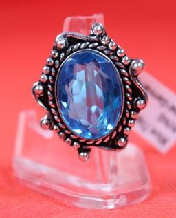 Three German silver rings. One size 6 Blue Topaz stone, one size 7 green emerald stone and one size