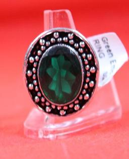 Three German silver rings. One size 6 Blue Topaz stone, one size 7 green emerald stone and one size