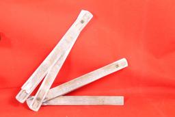 Two Craftsman old style folding rulers, one wood and one metal