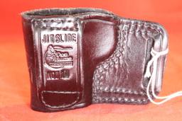Black leather Don Hume right handed slide holster. Used.