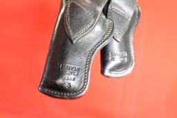 Two black tooled Bianchi leather right handed holsters. Used.