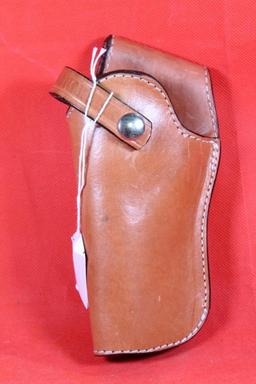 Brown leather left handed snap holster for revolver. Used but in very nice condition.