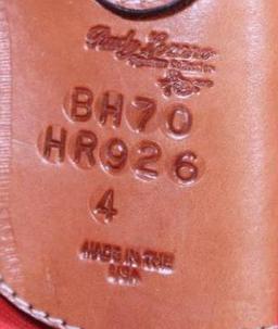 Brown leather left handed snap holster for revolver. Used but in very nice condition.