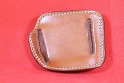 Small Galco brown leather left handed belt holster. Used in good condition.