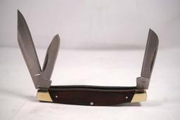 Buck Model 371 stockman with 2.75 inch main blade. Hardwood scales. NIB made in China.