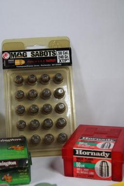Box containing 4 boxes of .50 cal bullets, .50 cal Mag sabots, and other muzzleloader items