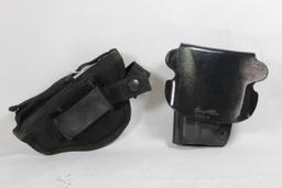 Two right handed holsters. One belt clip and one paddle.