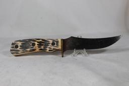 Imperial sheath knife with 5 inch blade. Leather sheath. Synthetic grips. Knife shows some rust and