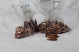 Two bags of 7mm bullets. FMJ. Count 200 +/-.