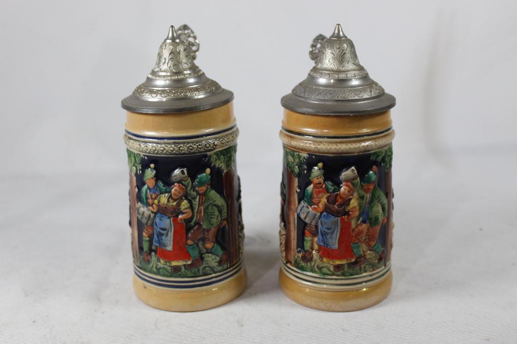 Two small German beer steins.