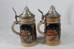 Two small German beer steins.