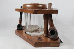 Wood six pipe table stand with wood lid glass tobacco storage jar. Also two burl pipes, used.