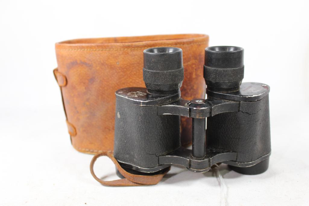 One pair of Holt's 6x30 binoculars. Used in lid less leather case.