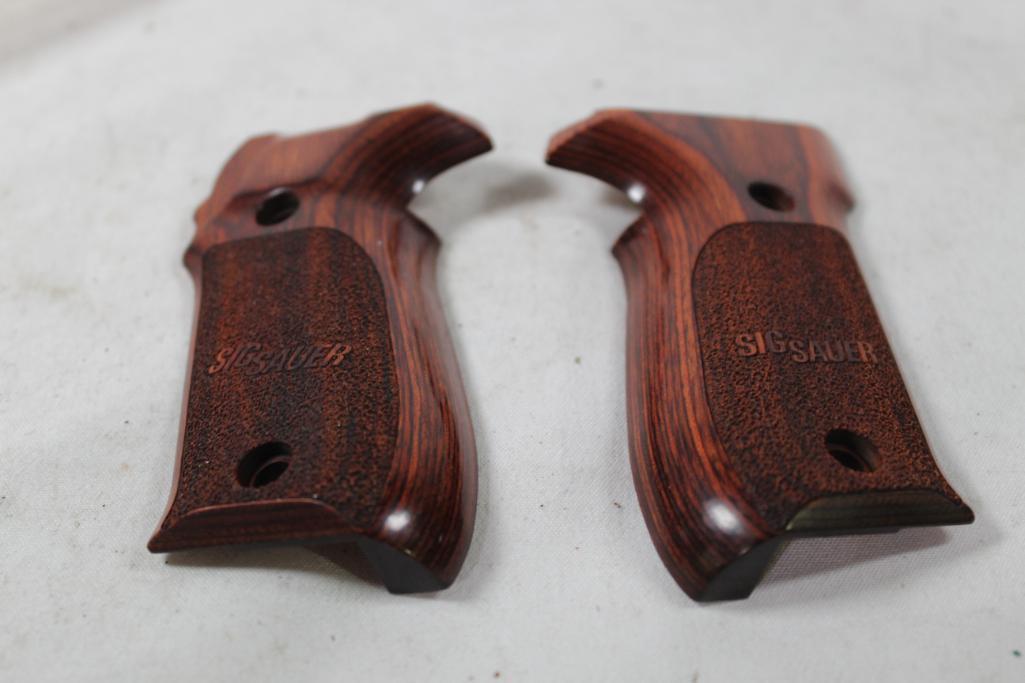One set of Sig Sauer wood pistol grips. Look new.