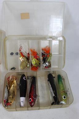 Four plastic compartment boxes with fishing lures and spinners. Used.