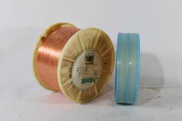 Two spools of nylon fishing line. One 20lb and one 250lb.