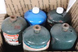 Five 1lb propane fuel cans, two are full, others are partial.
