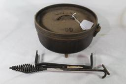 Lodge 10" Dutch oven with lid handle and coal stand. Used.