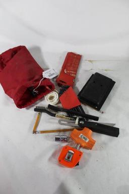 Red nylon bag with miscellaneous tools. Used.