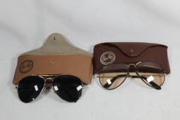 Two pairs of Ray-Ban sunglasses. Used, in cases.